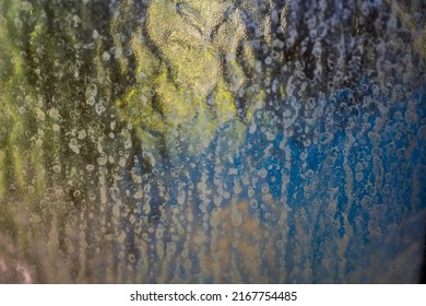 Frosted Glass Of Privacy Glass Abstract Texture Wallpaper. Blue And Green Tone Refracting From Behind. Close Up Shot, No People.