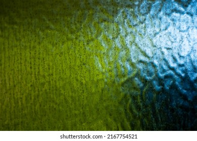 Frosted Glass Of Privacy Glass Abstract Texture Wallpaper. Blue And Green Tone Refracting From Behind. Close Up Shot, No People.