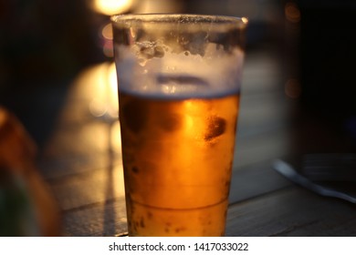 Frosty Icy Cold Beer In Glass With Sun Backlight