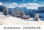 Frosty morning view of Alpe di Siusi village. Breathtaking winter landscape of Dolomite Alps. Majestic outdoor scene of ski resort, Ityaly, Europe. Beauty of nature concept background.