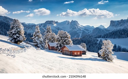 Frosty morning view of Alpe di Siusi village. Breathtaking winter landscape of Dolomite Alps. Majestic outdoor scene of ski resort, Ityaly, Europe. Beauty of nature concept background.