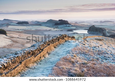 Frosty Morning,Hadrian's Roman Wall on Winshields Crags, looking towards Crag Lough in Northumberland, England
