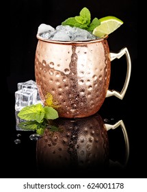 Frosty Moscow Mule In A Copper Cup Isolated On Black Background