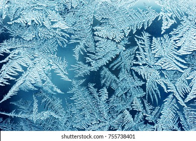 Frosty Pattern On The Window Close-up. Winter Background, Texture