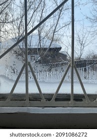 Frosty pattern on the window, winter, cold