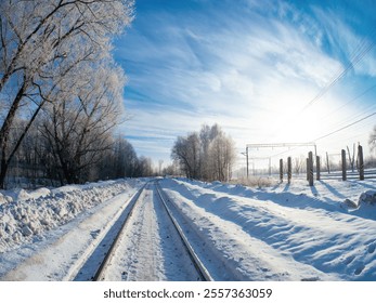 A frosty winter morning with a sunny blue sky. Railway winter landscape - Powered by Shutterstock