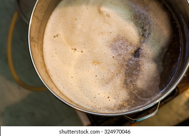 Froth of Home-Brew Mash in a Stock Pot While Sparging the water to Drain the Sugar
