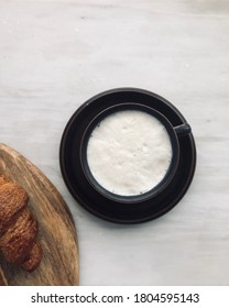 Frothy Oat Milk Latte With Croissant.