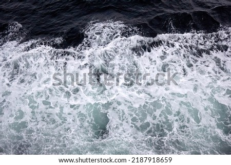 Frothy ocean waves with whitecaps in the Pacific Ocean.