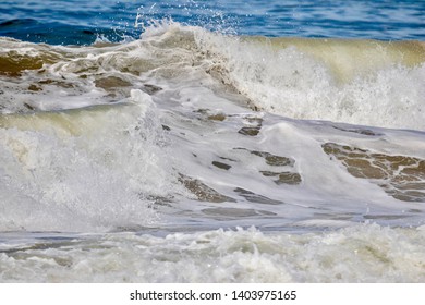 frothy wave in the ocean close up
