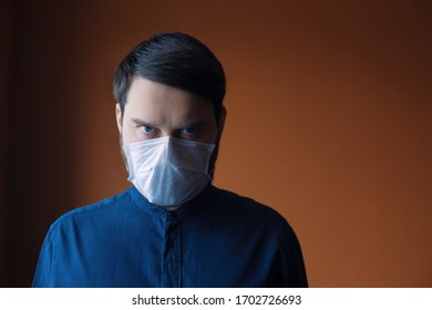 Frowned man in protective mask with copy space. Coronavirus covid 19 threat