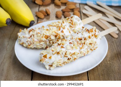 Frozen Banana Covered With Yogurt And Almonds