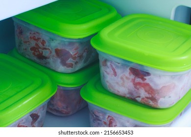 Frozen barf food for cats. Biologically appropriate raw food. Boxes with raw meat in the freezer, ready to be defrosted and offered to animals.