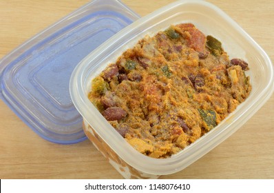 Frozen Beef Chili Leftovers Thawing In Plastic Storage Container For Easy Quick Dinner