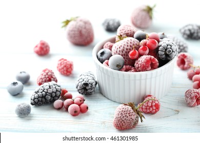 Frozen Berries On A White Wooden Table