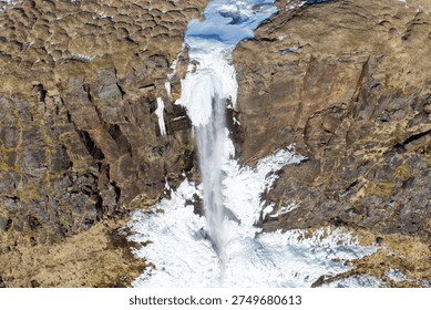 Frozen Bjarnarfoss Waterfall from an Elevated Drone Perspective