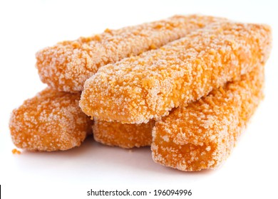 Frozen Bread Crumbed Fish Fingers On White.