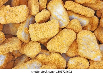 Frozen Breaded Orange Chicken Nugget Sticks Texture In The Market Fridge As A Background. Close Up Photography