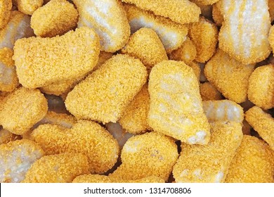 Frozen Breaded Orange Chicken Nugget Sticks Texture In The Market Fridge As A Background. Close Up Photography