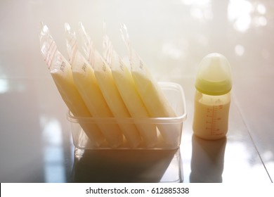 Frozen Breastmilk In Storage Bags And Baby Bottle, Vintage Style