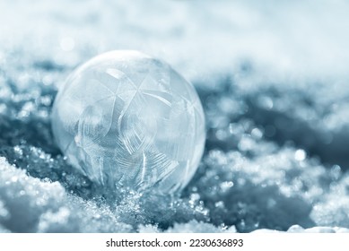 frozen bubble with bokeh background. Beautiful frosty patterns on frozen soap bubble. winter, frosty background. Macro photo - Powered by Shutterstock - Get 15% off with code: PIKWIZARD15