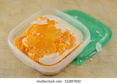 Frozen Butternut Squash Leftovers Thawing In Plastic Container