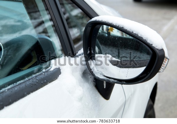 The frozen car mirror\
and rear window