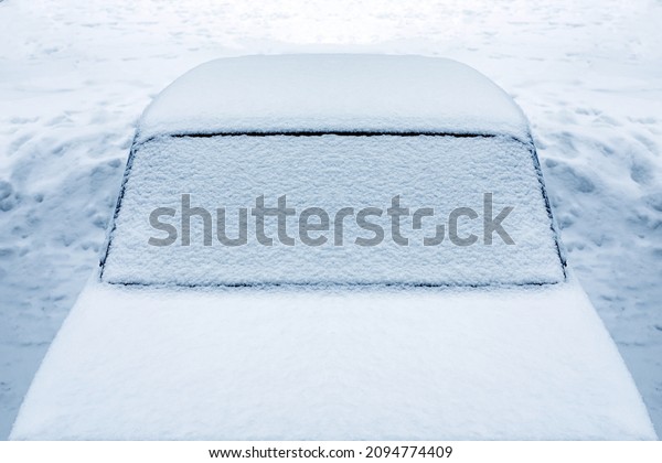 frozen\
car on the street in winter. High quality\
photo