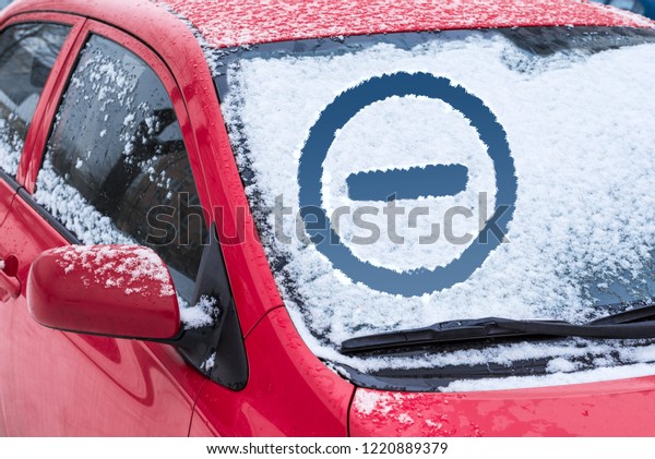Frozen car window. Inscription on glass\
brick sign. Concept of not driving in a\
snowstorm.