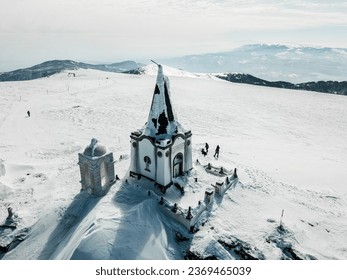 Frozen chapel on the peak of the mountain Voras winter Greece kaimaktsalan v7 - Powered by Shutterstock