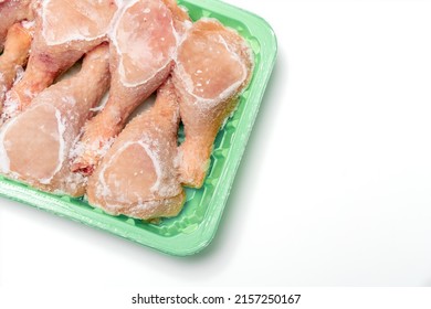 Frozen Chicken Meat In An Open Package. Chicken Legs On A White Background.