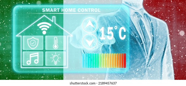 Frozen Citizen Of Italy Adjusting Heating Temperature On A Virtual Screen Of Smart Home Controller, Winter Blizzard. Concept Of Forced Thrift, Energy War And Increased Price For Natural Gas.