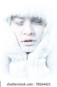 Frozen. Close-up Portrait Of Chilled Female Face Covered In Ice.