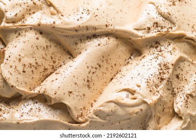 Frozen Coffee Flavour Gelato - Full Frame Detail. Close Up Of A Beige Surface Texture Of Ice Cream Covered With Brown Coffee Powder On The Surface.