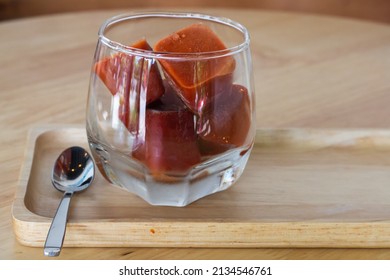 Frozen Coffee Ice Cubes In Clear Glass Close-up.