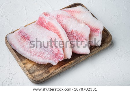 Frozen fish fillet, on white background