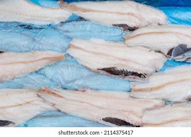 Frozen Fish Longtail Hake In A Box. Packaging With Interleave Plastic Film And Fish. Argentine Tradel Fish, After Primary Processing On A Trawler, Is Ready For Sale