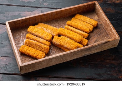 Frozen Fish Sticks. Organic Fish Food Set, In Wooden Box, On Old Dark Wooden Table Background