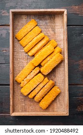 Frozen Fish Sticks Set, In Wooden Box, On Old Dark Wooden Table Background, Top View Flat Lay