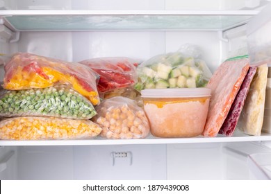 Frozen Food In The Freezer. Frozen Vegetables, Soup, Ready Meals In The Freezer. Frozen Meat, Food, And Vegetables  