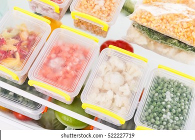 Frozen food in the refrigerator. Vegetables on the freezer shelves. - Shutterstock ID 522227719