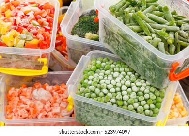 Frozen Foods Recipes Vegetables In Plastic Containers. Healthy Freezer Food And Meals.