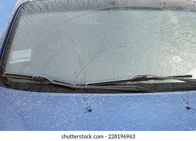 Frozen Front Windshield Of Car During Winter Morning