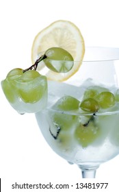 Frozen Grapes In Wine Glass Filled With Water