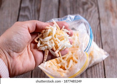 Frozen Grated Cheese In Hand In A Package