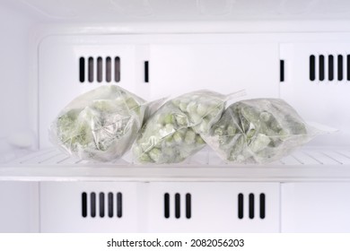 Frozen Green Pea In Bags In Freezer Close-up, Front View