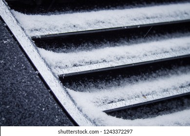 the frozen grille of the car. the silver grille of the car in the snow