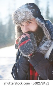 Frozen Hands Of Man With Beard