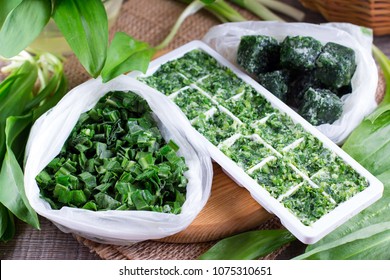 Frozen Herbs On A Wooden Background