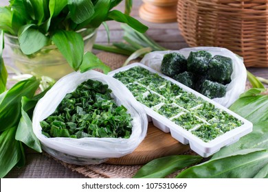 Frozen Herbs On A Wooden Table